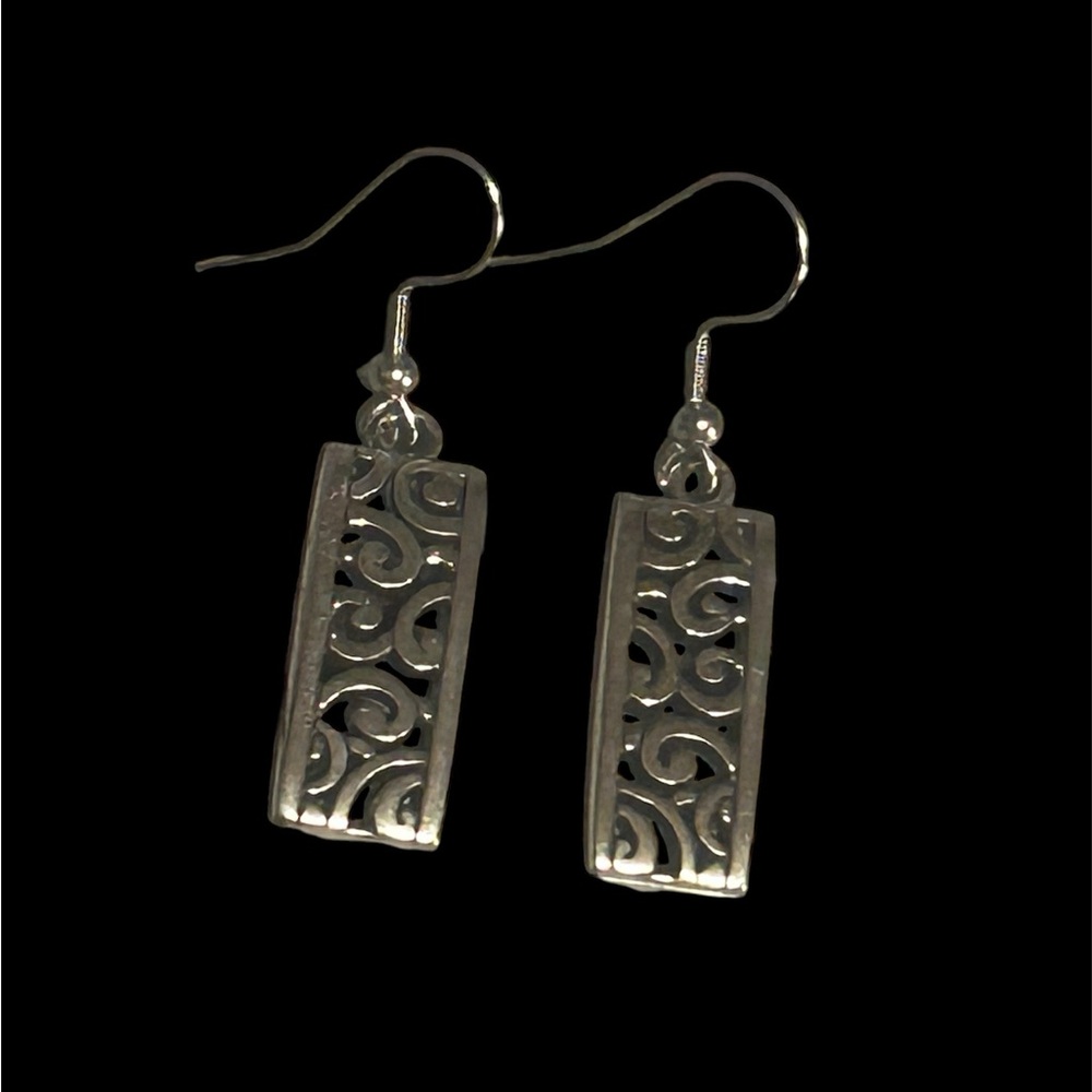 Ravether3volution Silver hypoallergenic filigree earrings.